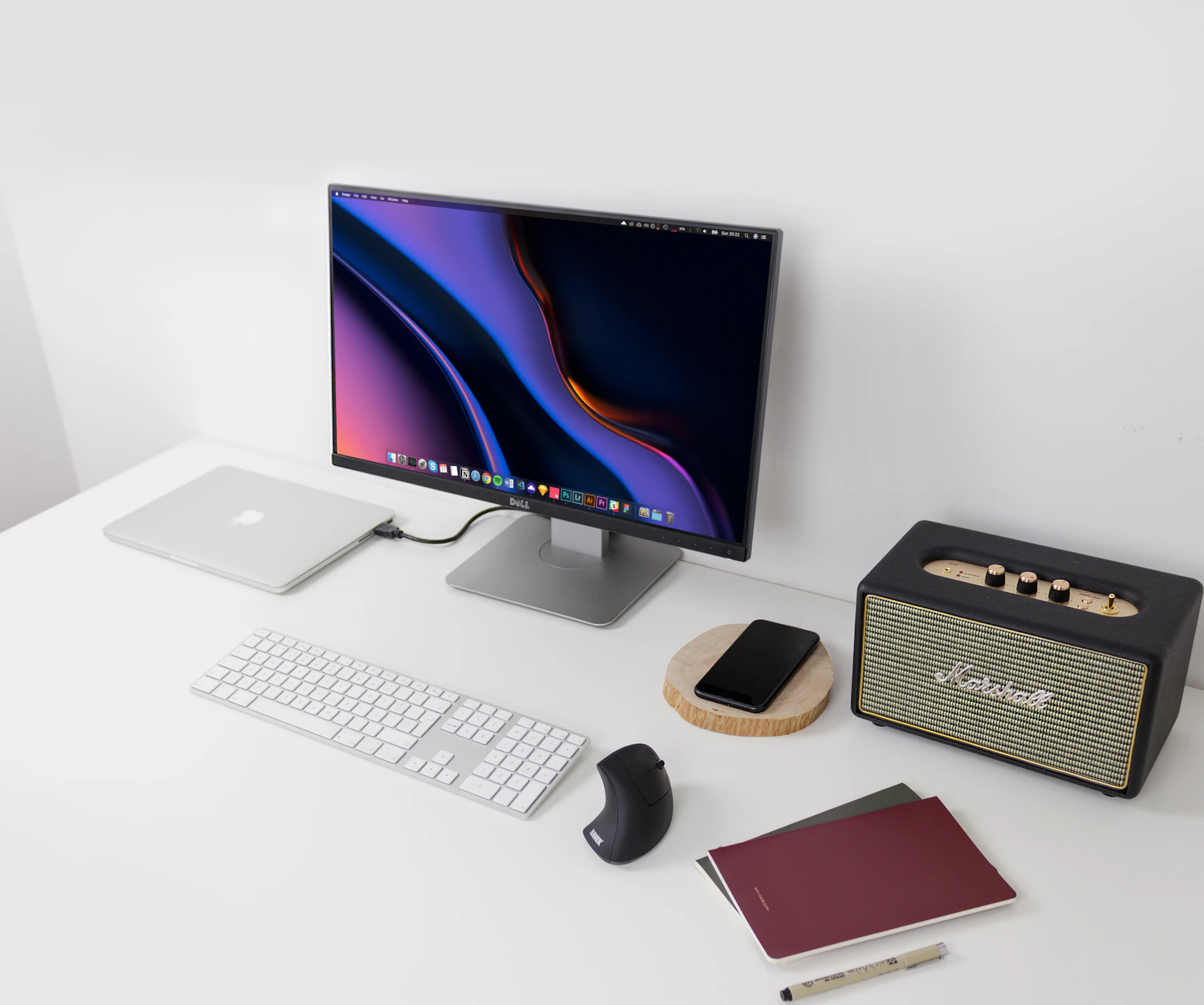 Laptop, monitor and keyboard on a modern desk setup