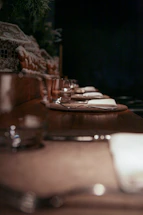 A cozy corner of Golden Ginger with warm lighting and a beautifully set table ready for guests.