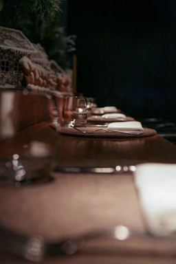A cozy corner of Golden Ginger with warm lighting and a beautifully set table ready for guests.