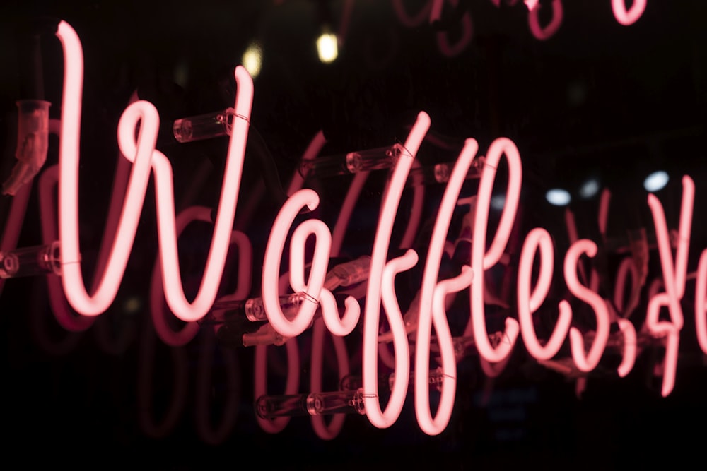 Waffles neon light signage on wall