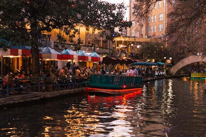 people sitting near body of water
