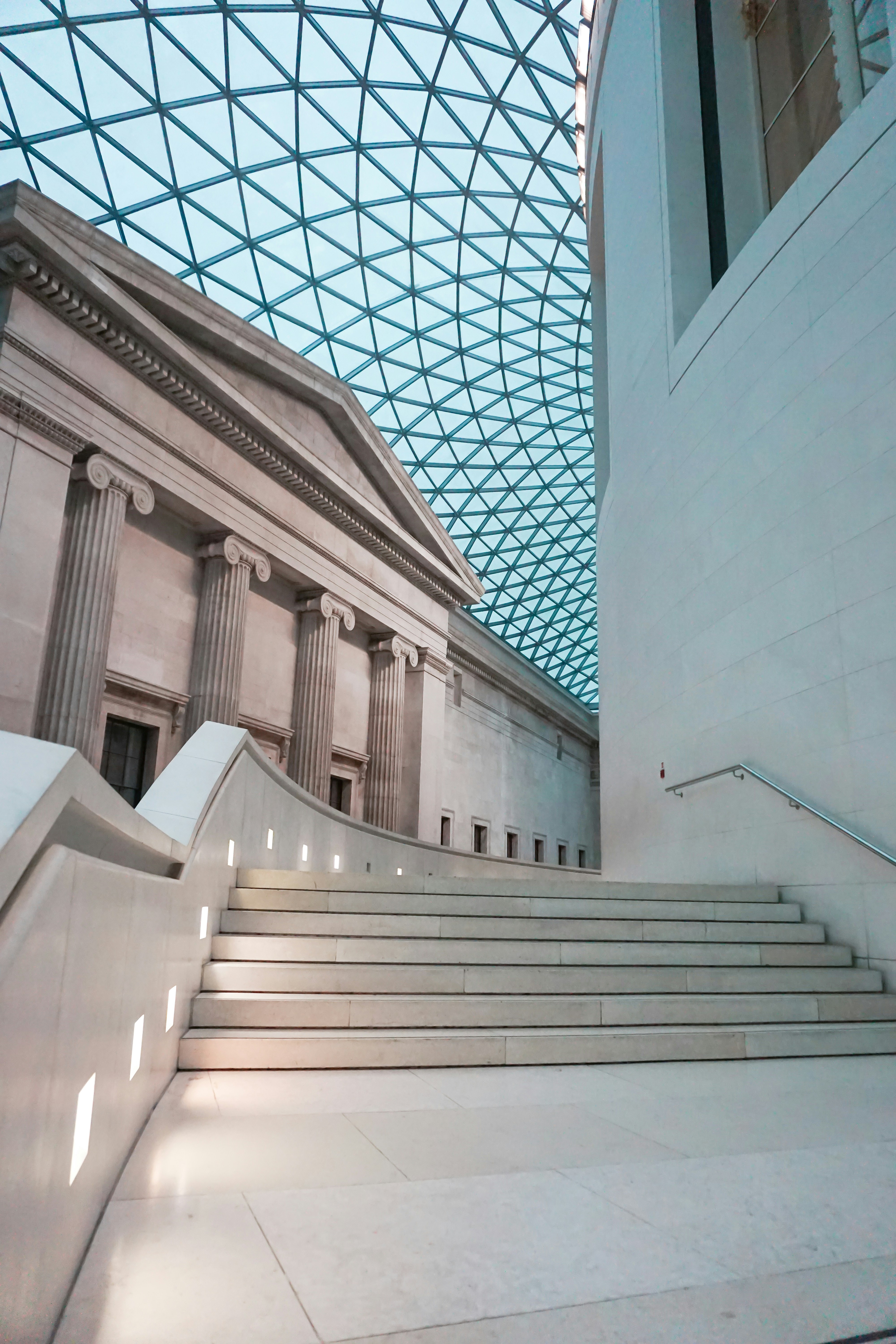 White staricase inside hall of the British Museum, London