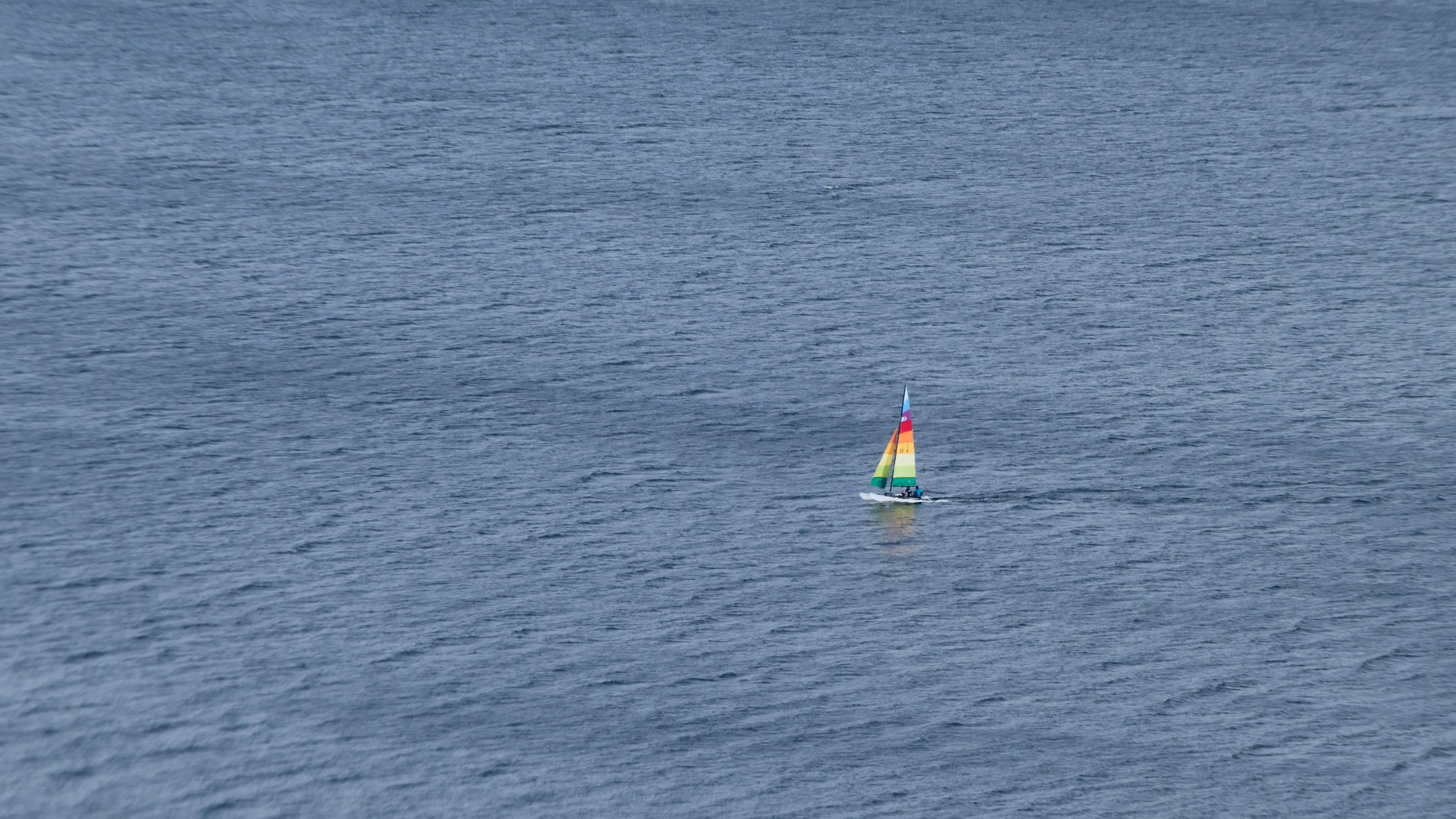 wind surf boat on the body of water