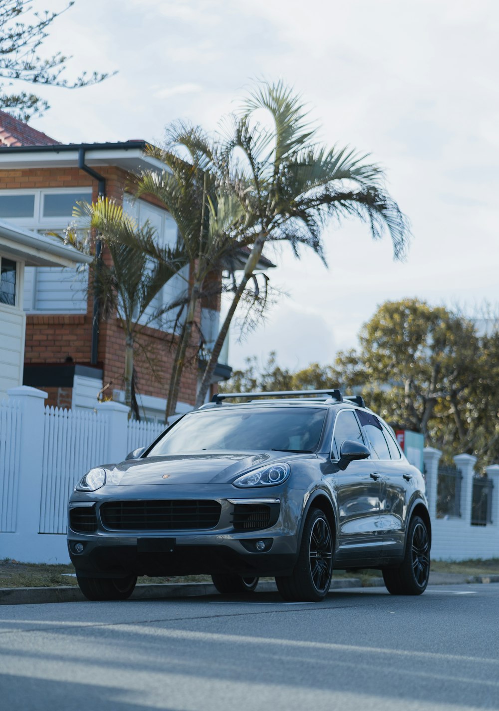 gray 5-door hatchback parked on concrete street