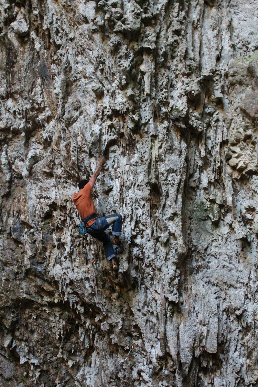 man climbing on rock formation