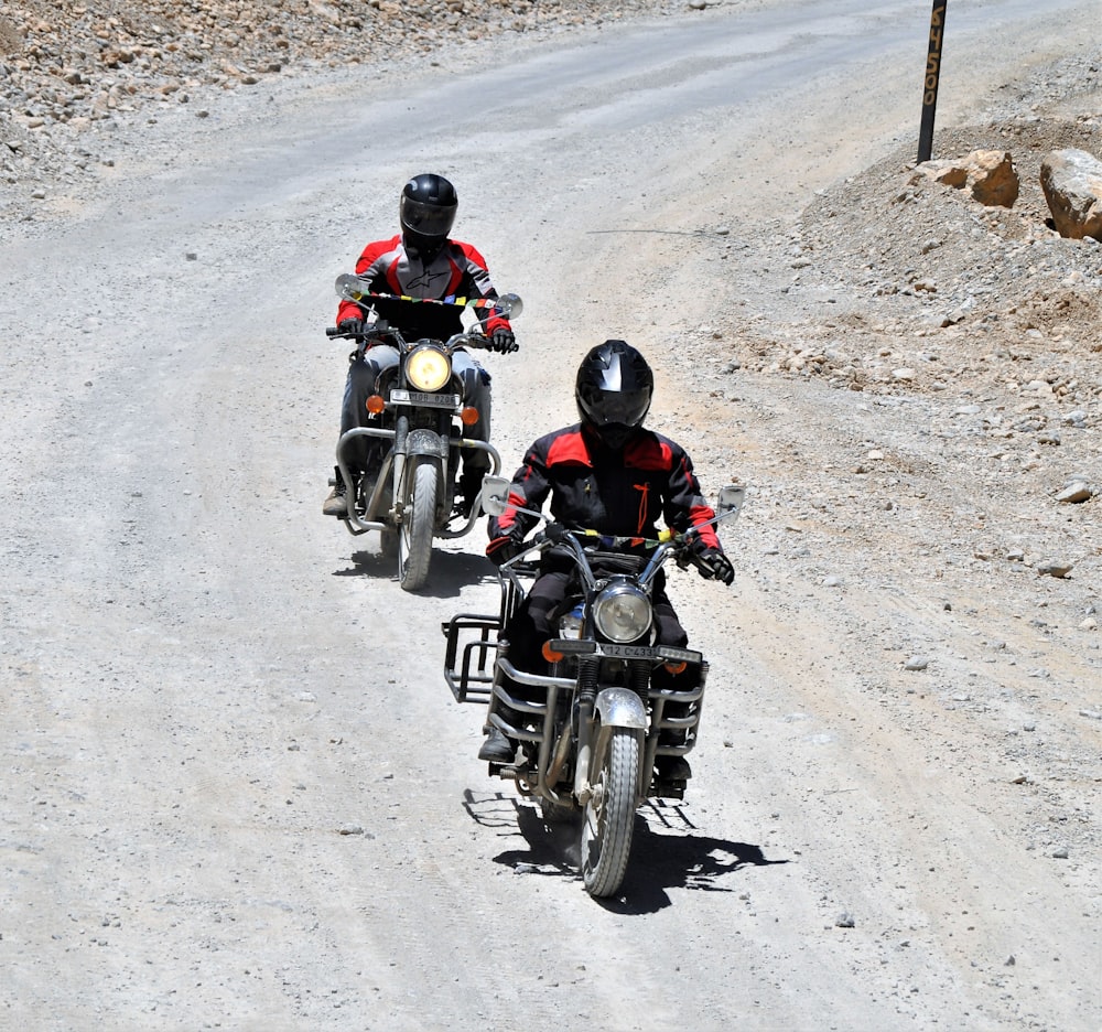 two men riding motorcycle