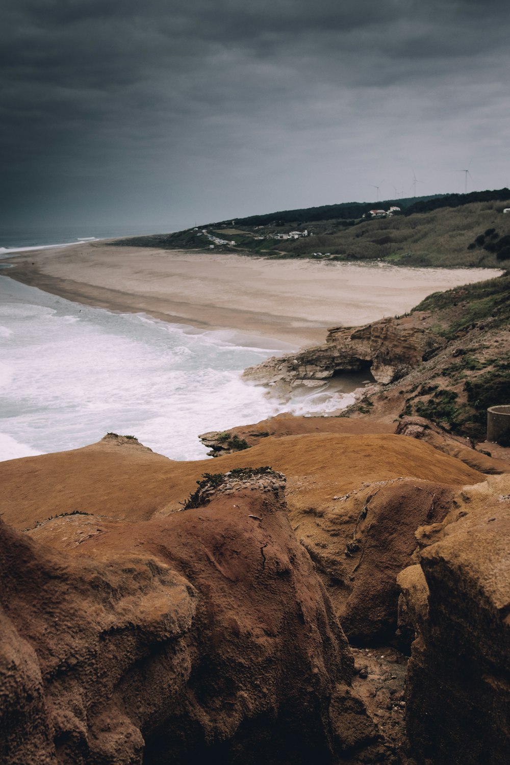 landscape photography of brown and green mountain range and shoreline