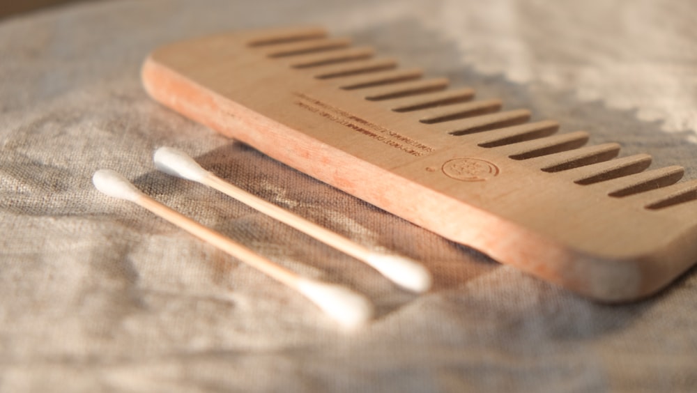 brown wooden hair comb