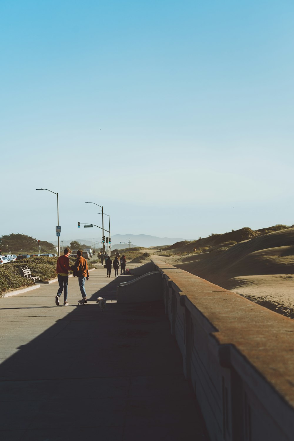 people walking in concrete pathway