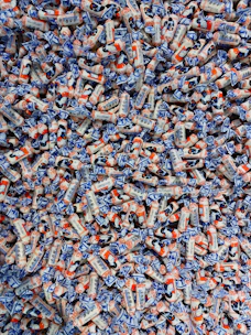 Close-up of assorted international candies and sweets in vibrant packaging.