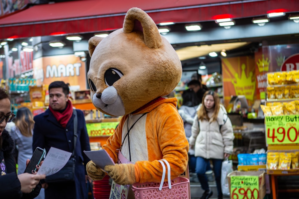 mascot giving out flyers during daytime