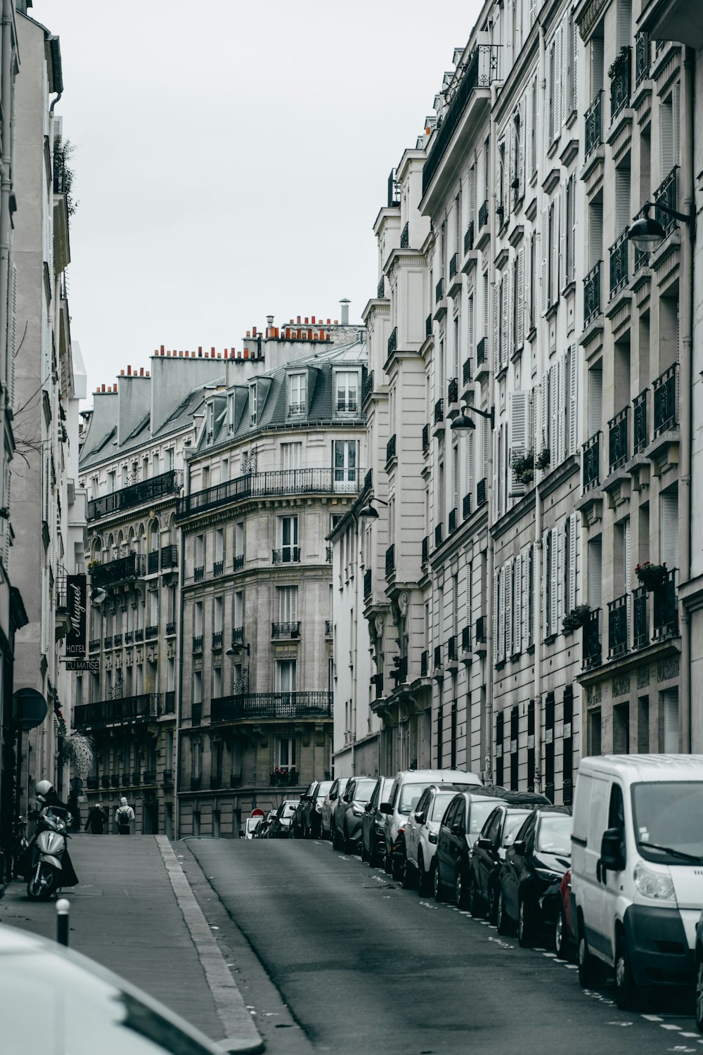 vehicles parked beside curb during daytime