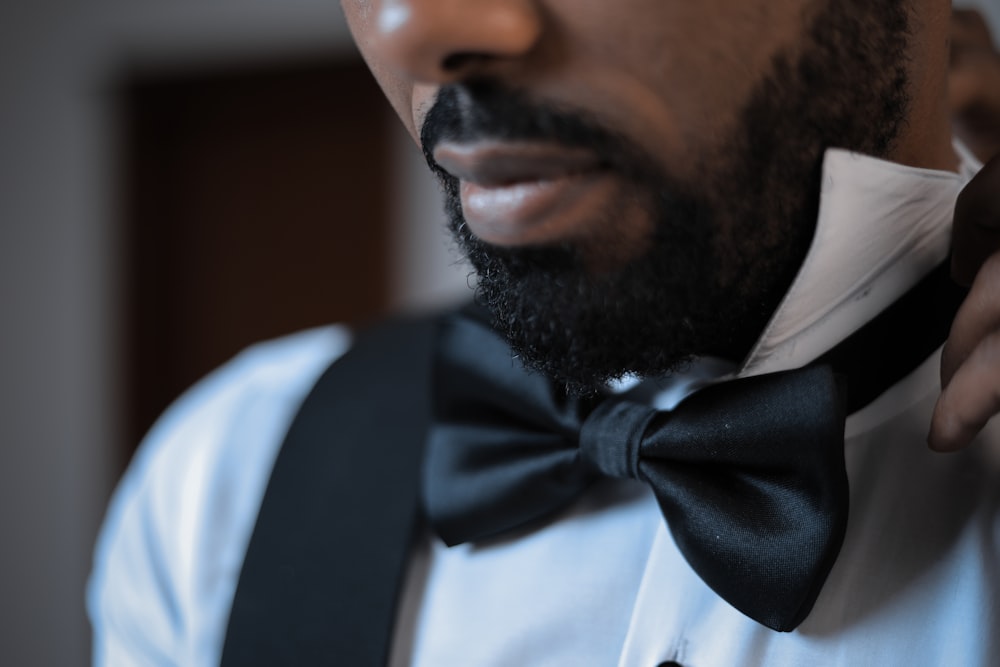 man wearing black bow tie