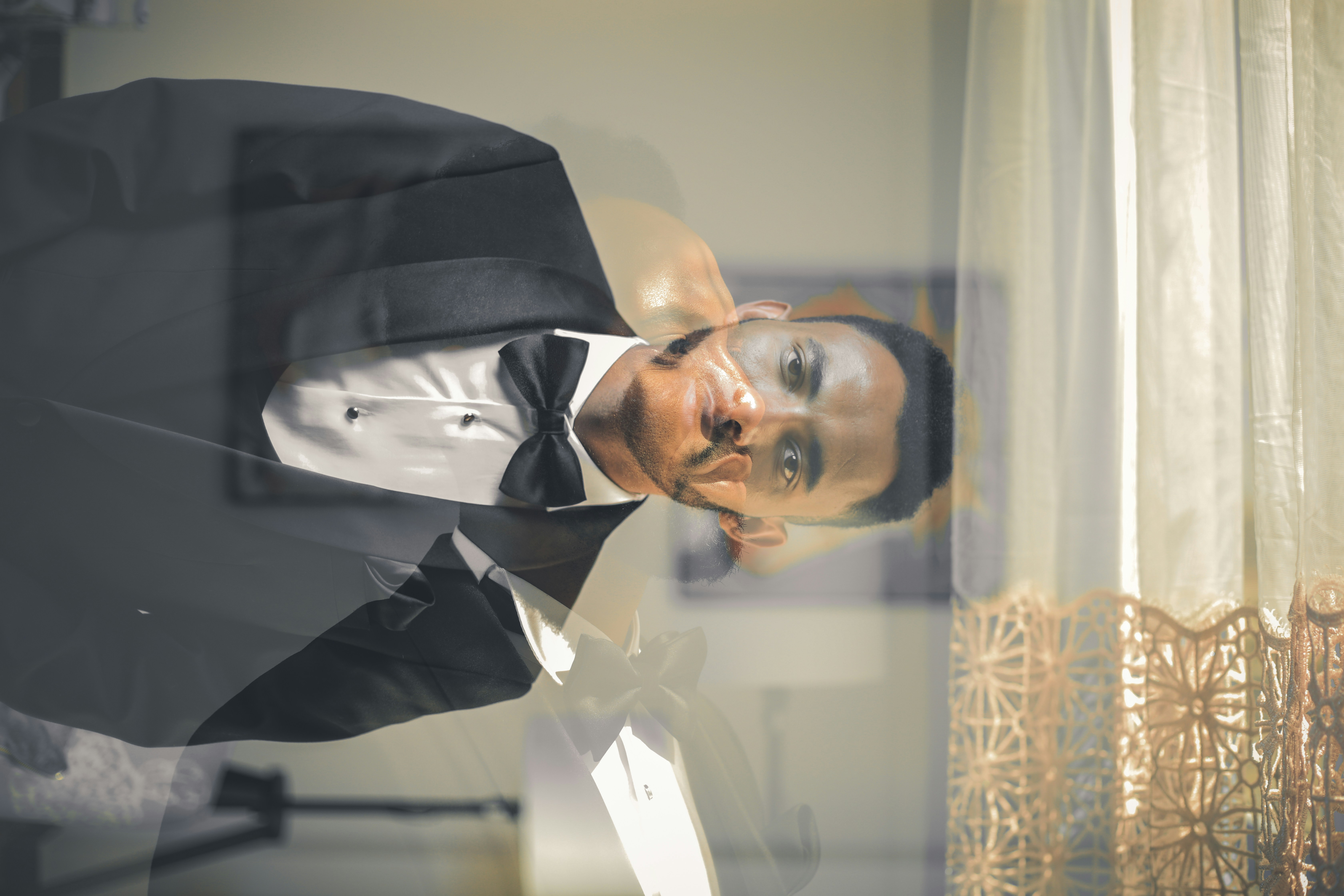 man wearing black suit jacket