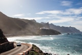 white car passing through road
