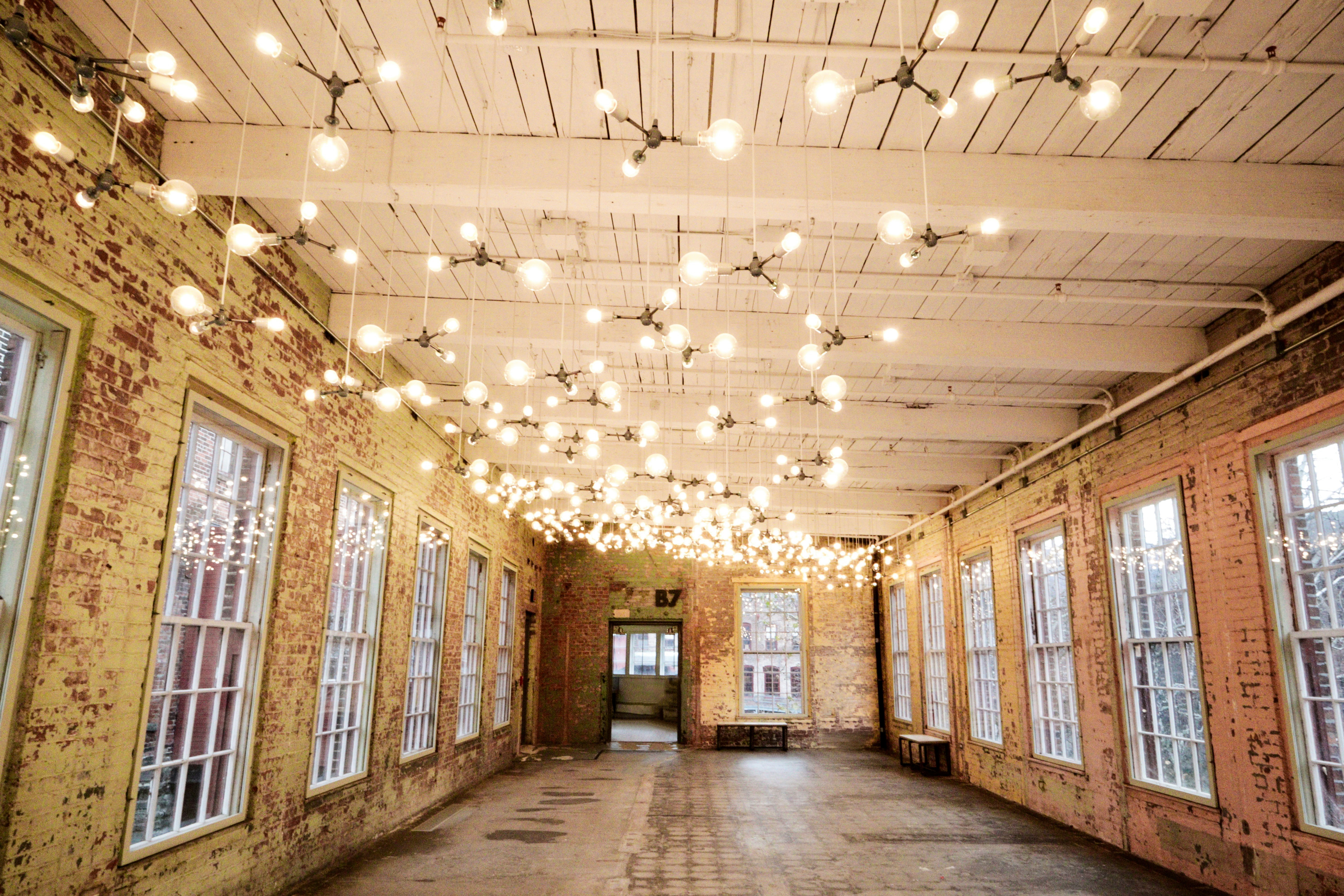 brown building interior with turned on ceiling lights