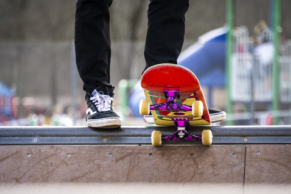 selective focus photography of person stepping on skateboard
