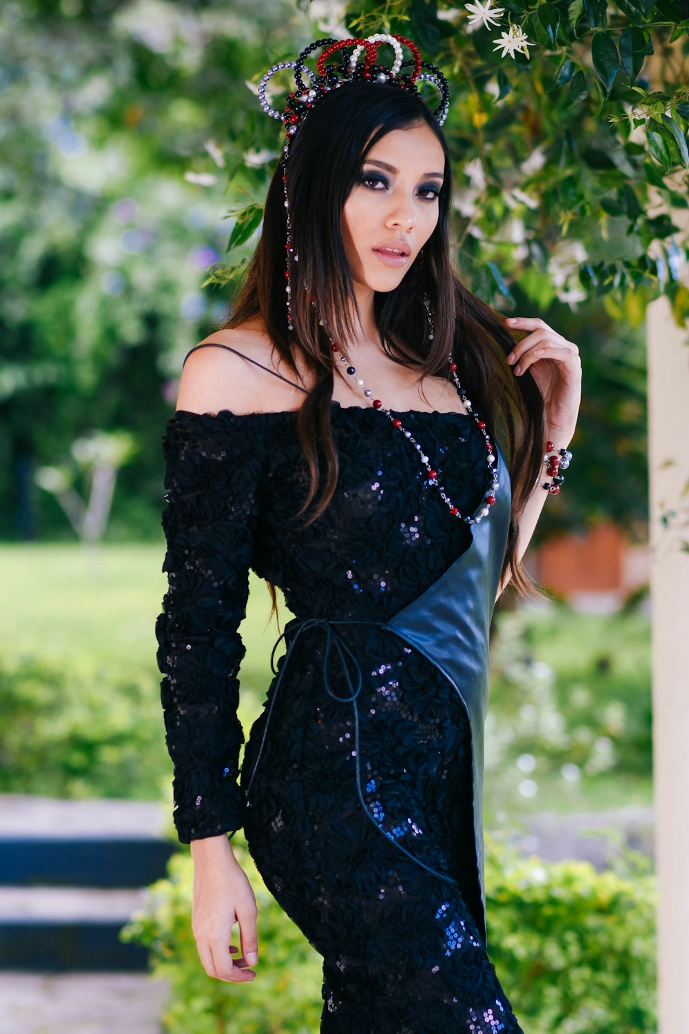 selective focus photography of blue sequined off-shoulder long-sleeved dress