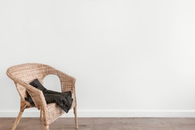 black textile on beige armchair chair teams background