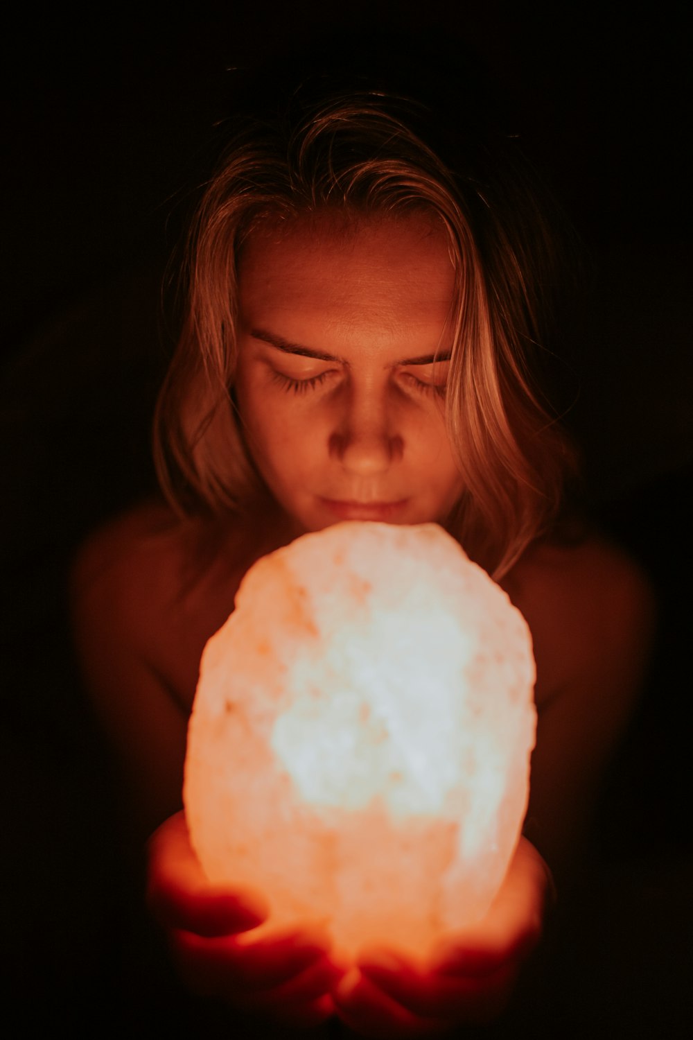 person holding Himalayan lamp