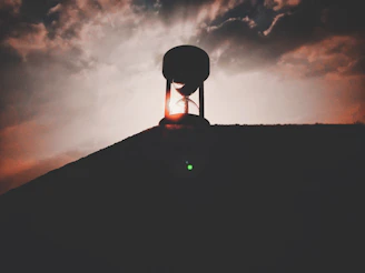 A contemplative scene of a wooden dervish figure turning slowly, illuminated by golden-hour sunlight.