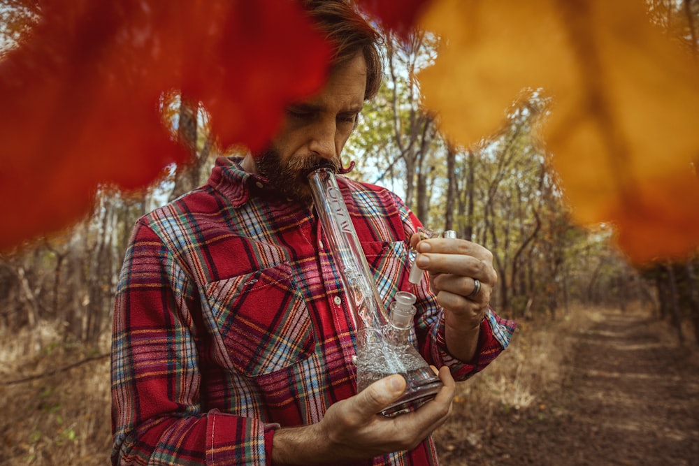 man smoking glass bong