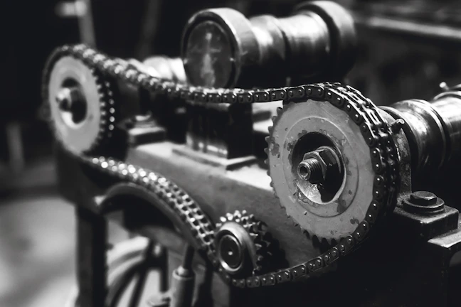 High-resolution image of a converting machine showcasing intricate mechanical parts highlighted by pure white and slate grey contrasts.