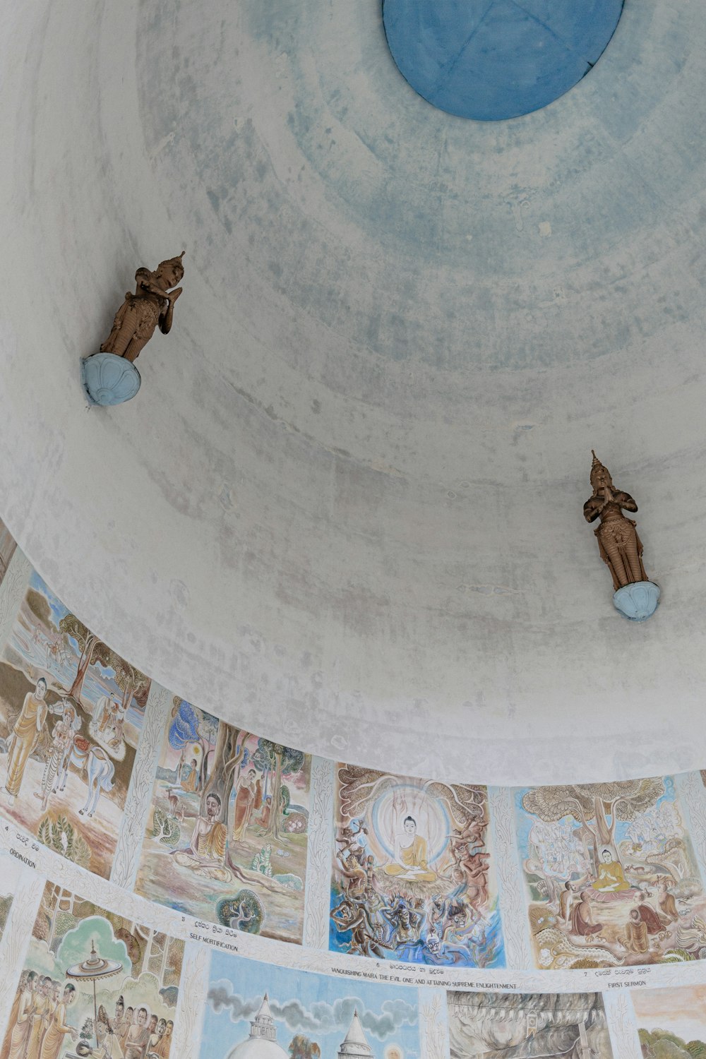dome ceiling with figurines and paintings
