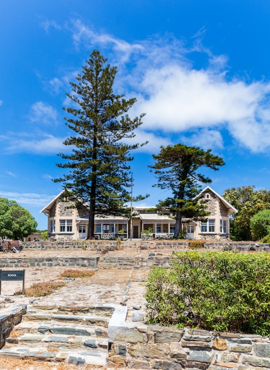 house near trees during day in Robben Island Museum South Africa