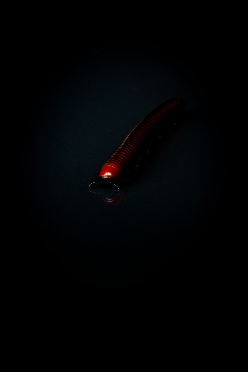 a red light shining on a black background