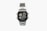 A silver digital wristwatch with a rectangular face displaying the time, world time map, and additional features. The watch has a metal strap and a robust, classic design.