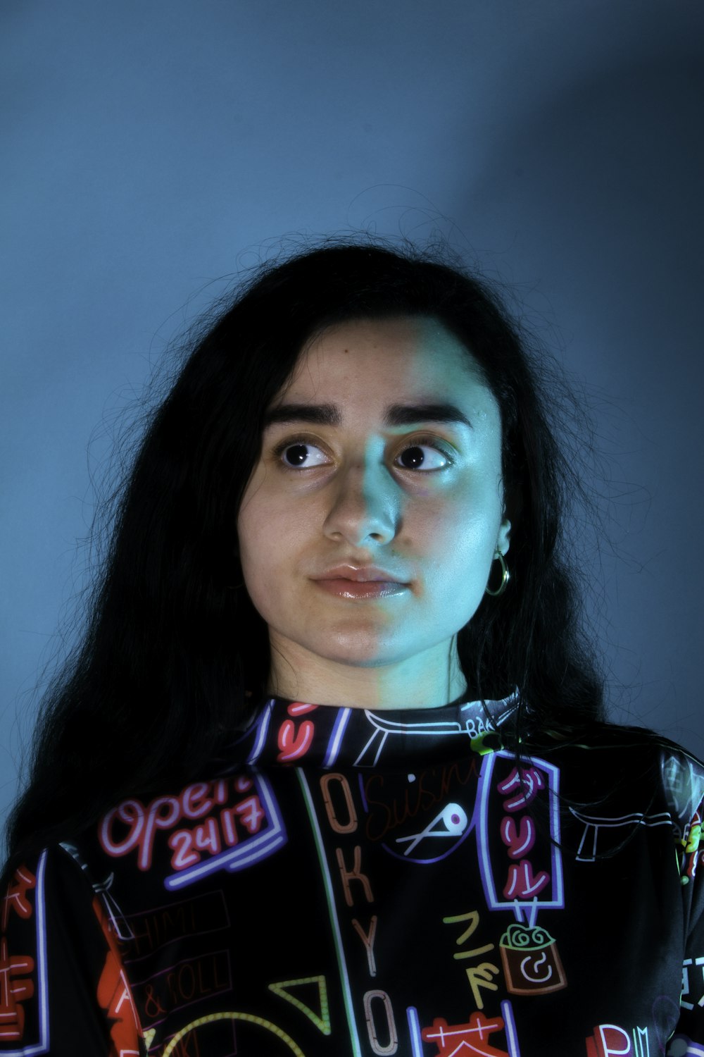 woman in black and multicolored collared top