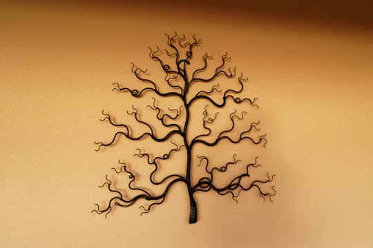 An artistic metal wall hanging with smooth welds and a rich powder-coated finish.