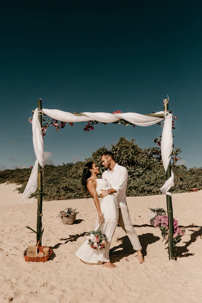 couple standing on shore during daytime