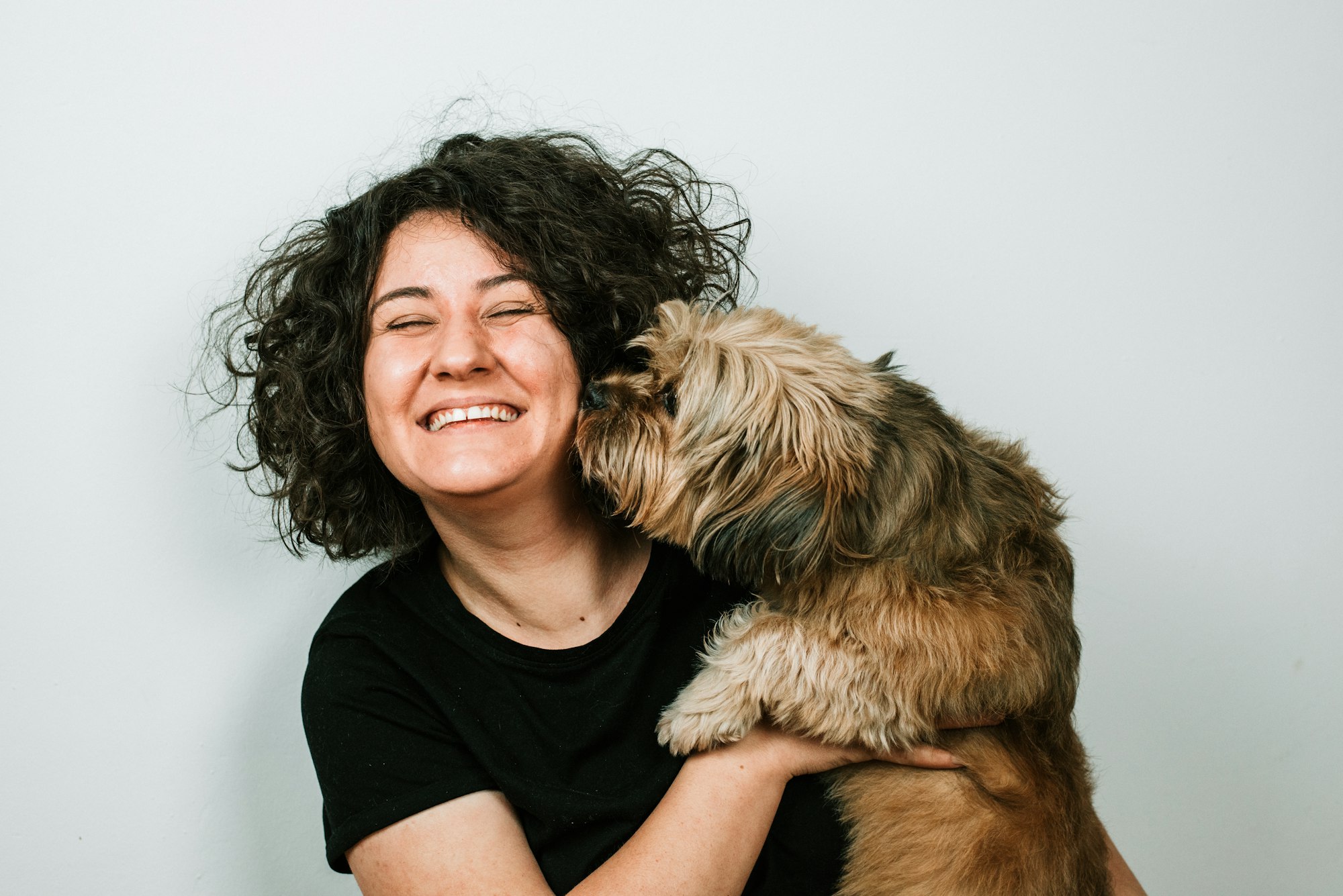 Girl laughing with dog