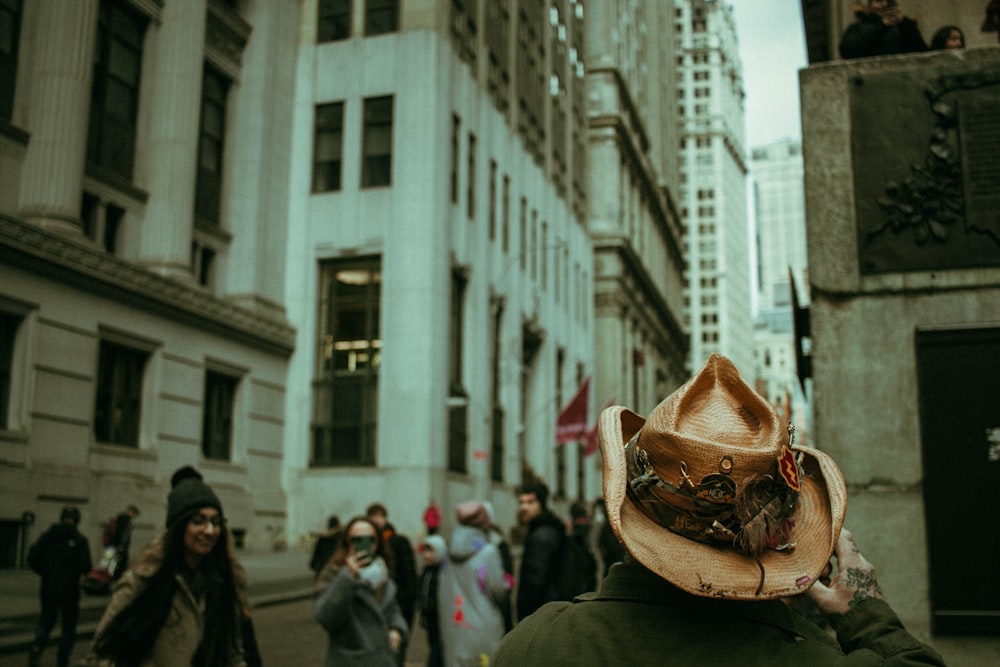 person wearing brown cowboy hat