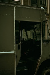 grayscale photography of a black bus