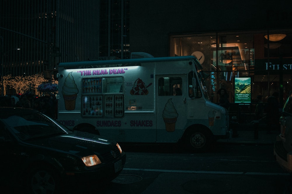 white and black ice cream bus during night time