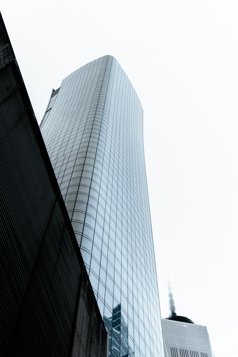 curtain wall high-rise building during daytime