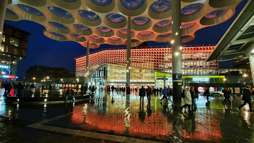 a group of people standing in front of a building