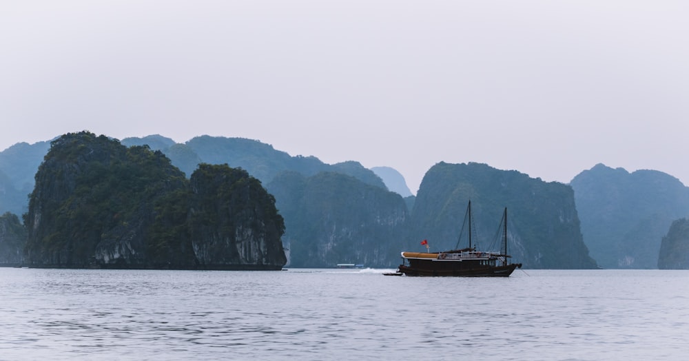 black boat near islet