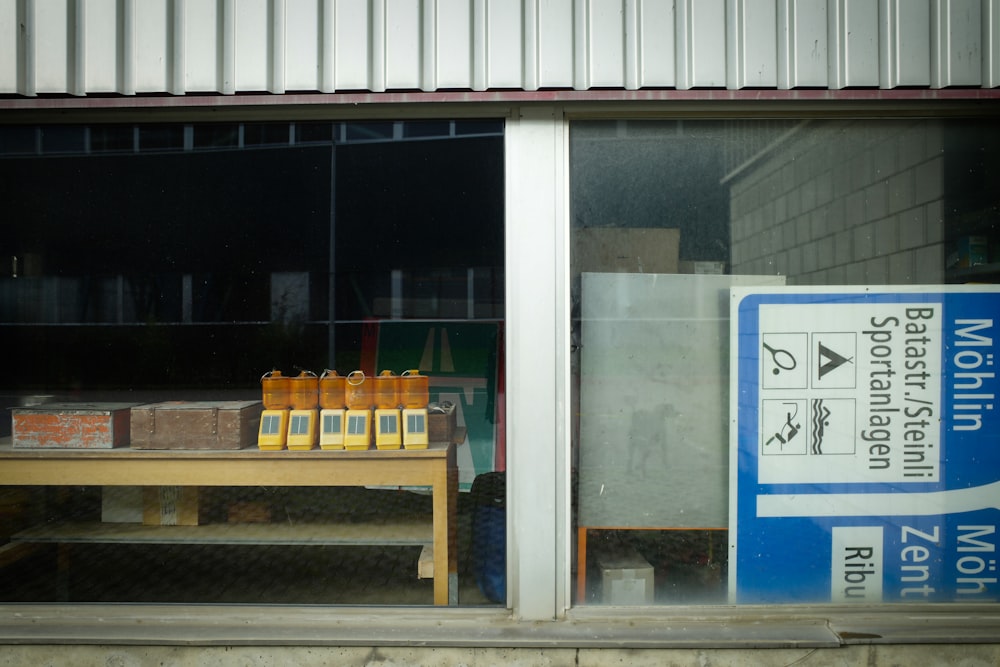 items on table top behind glass wall at daytime