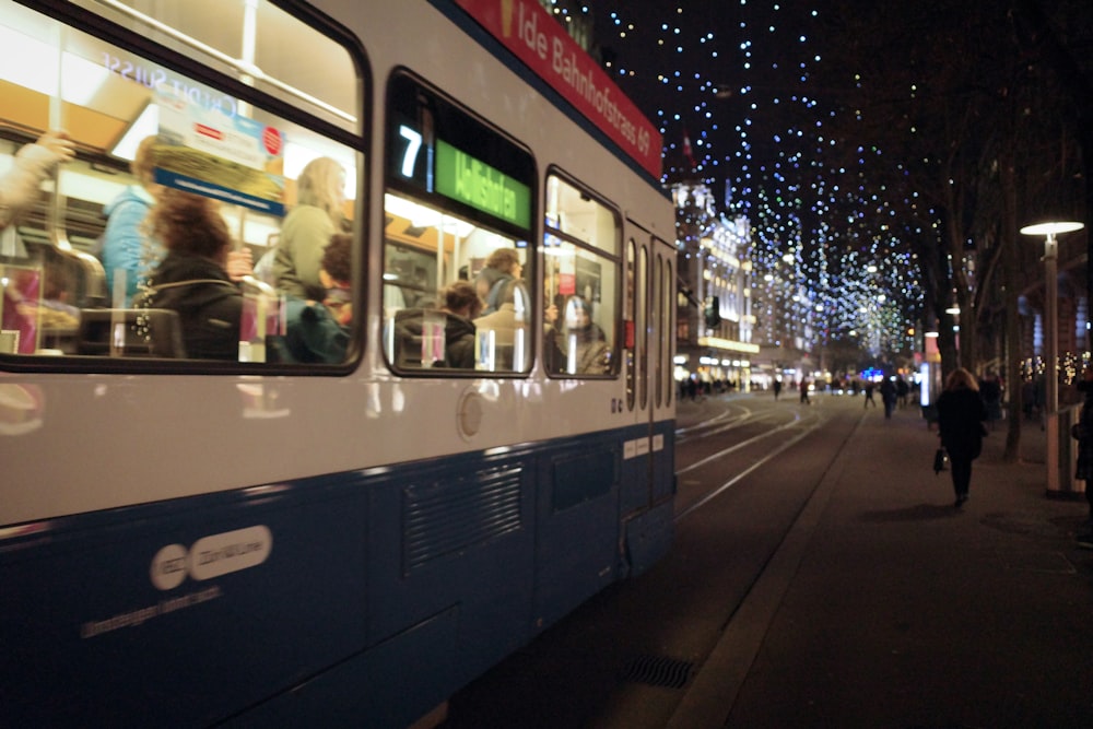 white and blue train at night