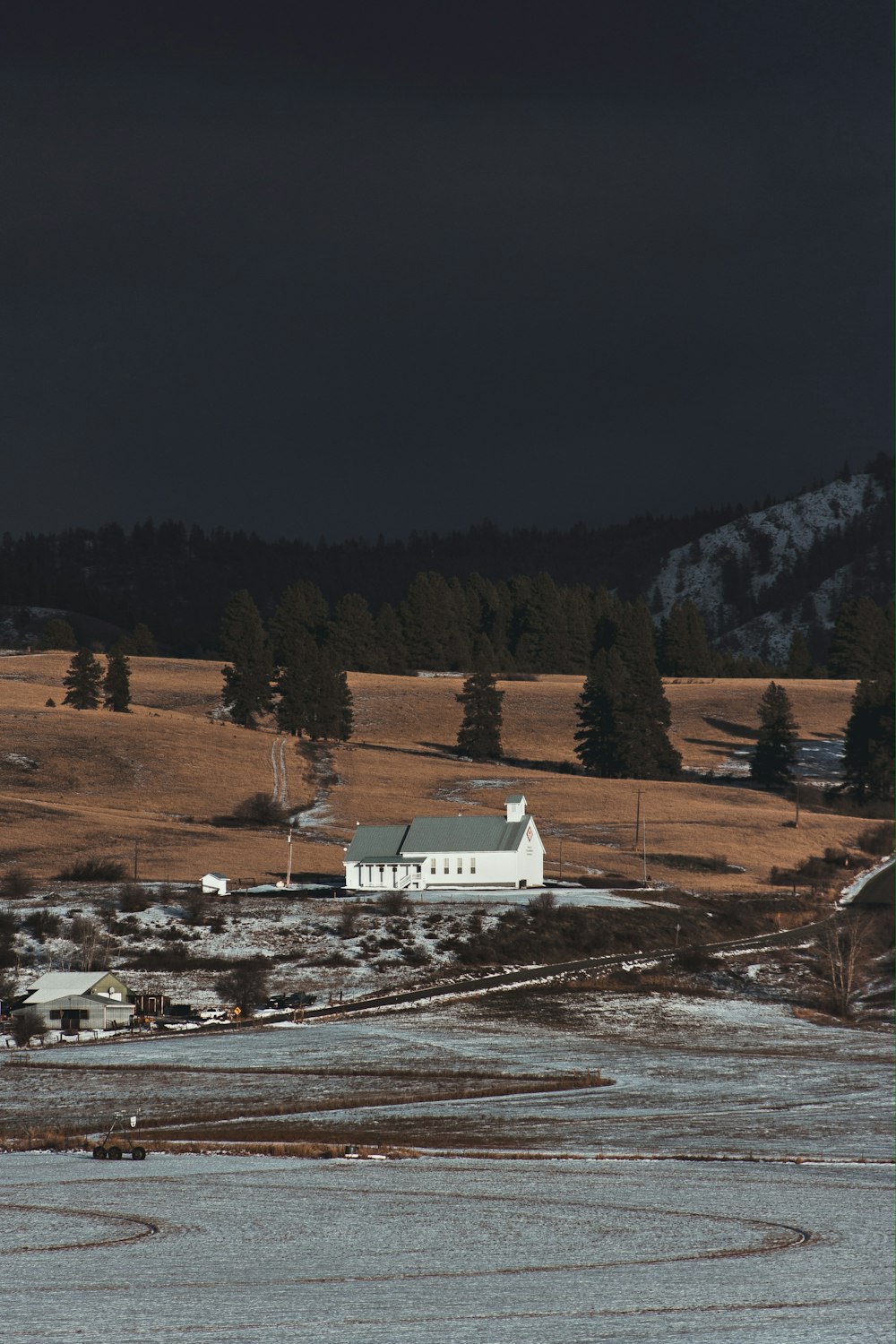 white and gray house on snowfield