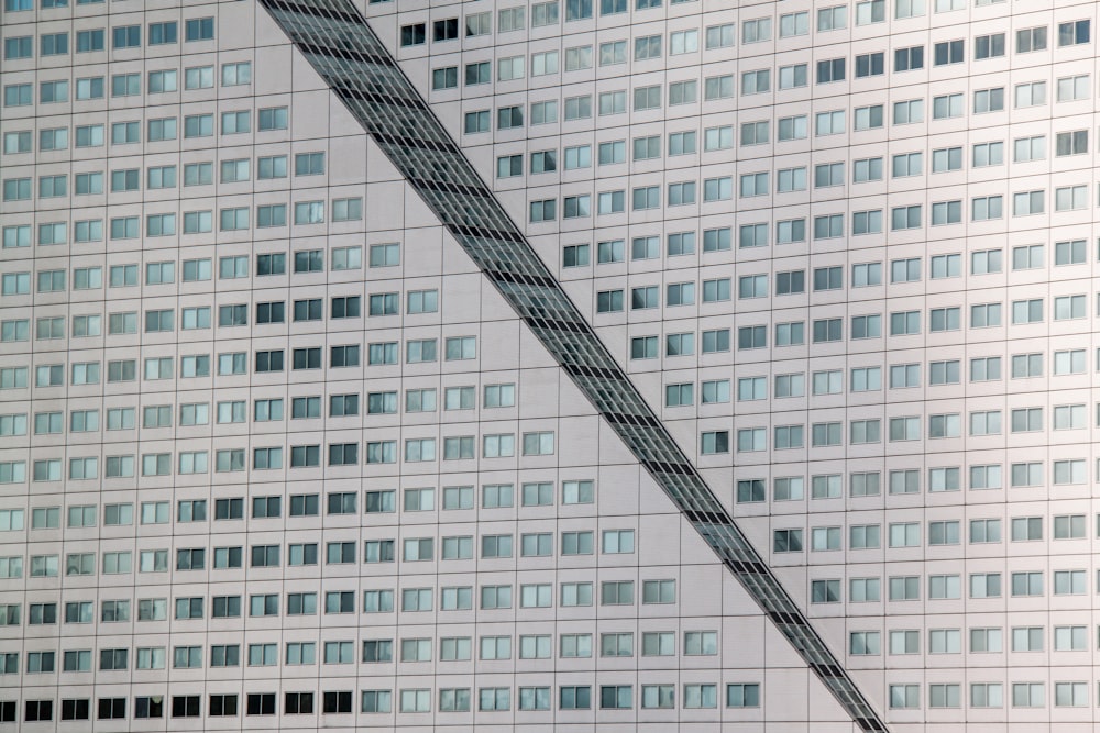 minimalist photography of a white high-rise building