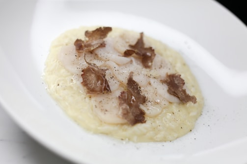 An elegant dish featuring truffle shavings on pasta.