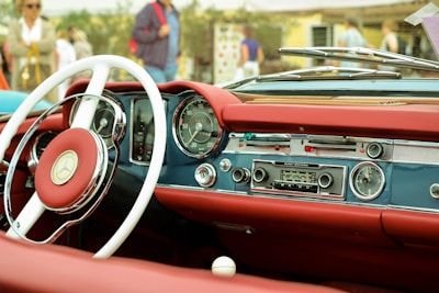 Vintage car interior showing restored period-correct dashboard and headliner.