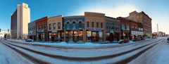 Brick storefronts on a snowy street in downtown Fargo, North Dakota