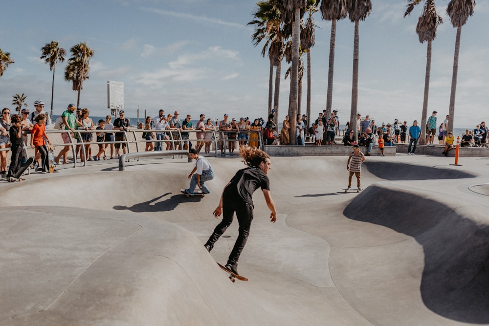 time-lapse photography of people skateboarding in a park