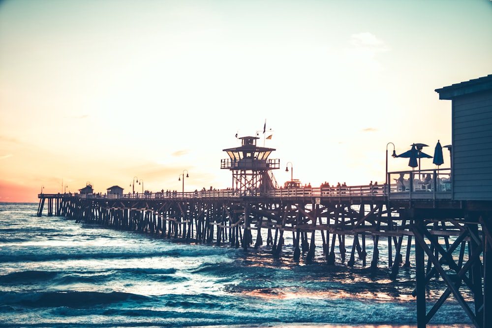 footbridge leading to the sea during golden hour